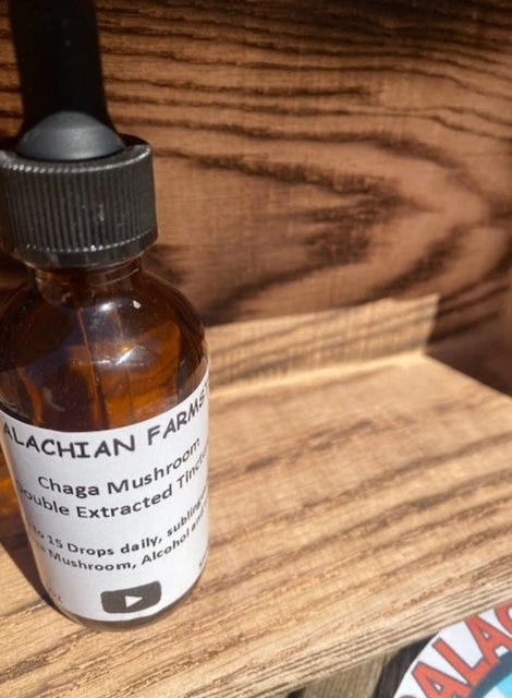 Organic Chaga mushroom tincture in amber glass bottle with dropper - 2oz immune support supplement